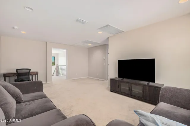 an aerial view of a house with a garden and trees