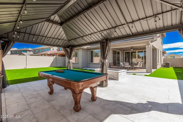 a front view of a house with a garden and parking space