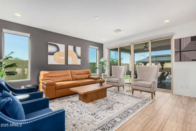 a living room with furniture and a large window