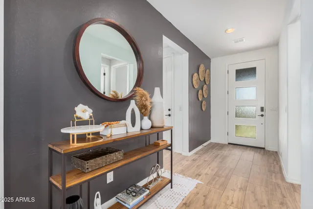 a kitchen with a stove and white cabinets