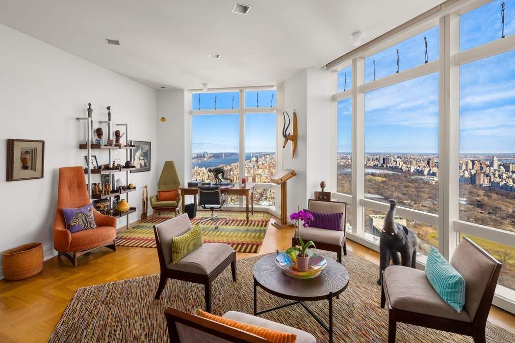 80 Columbus Circle, Unit 80 Manhattan, NY 10019 - Photo 11 of 30 a living room with furniture kitchen view and a large window