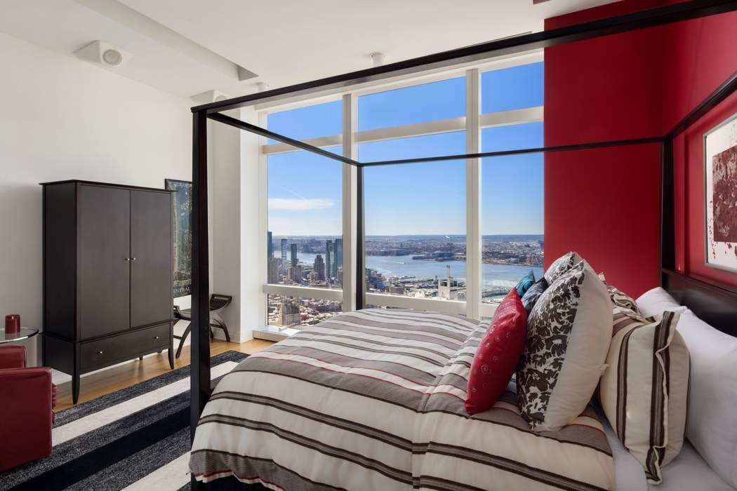 80 Columbus Circle, Unit 80 Manhattan, NY 10019 - Photo 16 of 30 a bed sitting in a bedroom next to a window