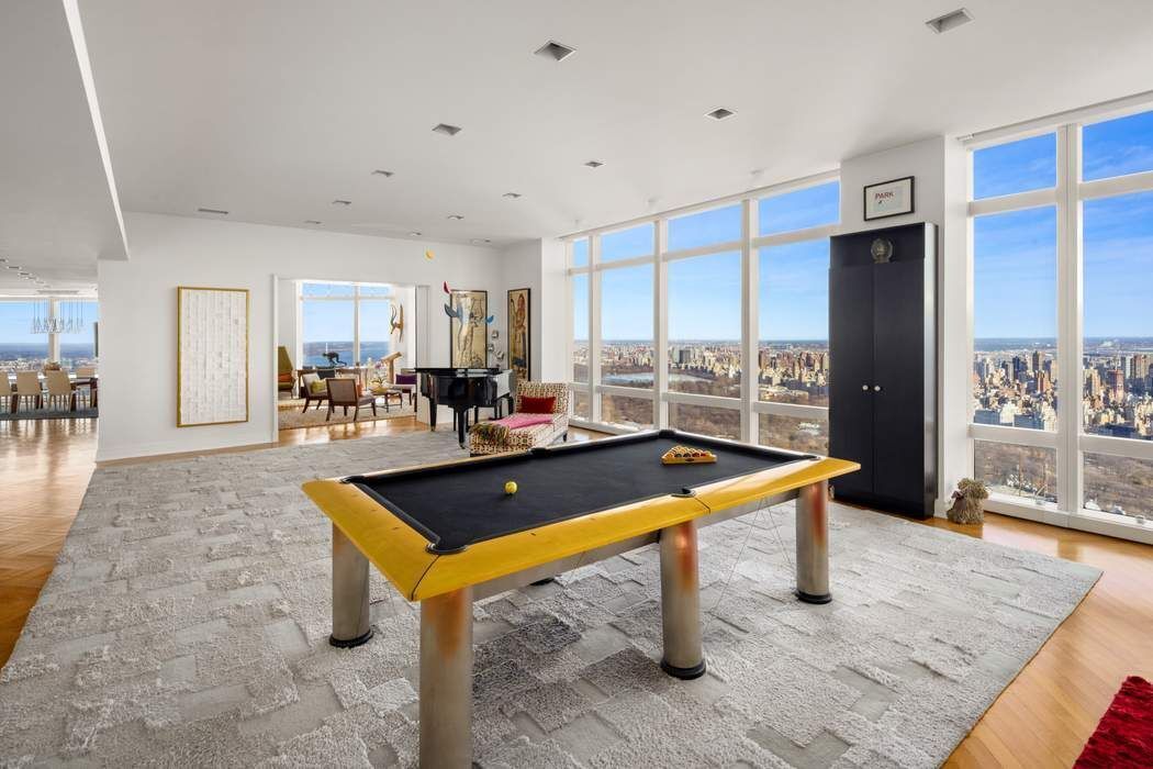 80 Columbus Circle, Unit 80 Manhattan, NY 10019 - Photo 10 of 30 a living room with furniture pool table and a table