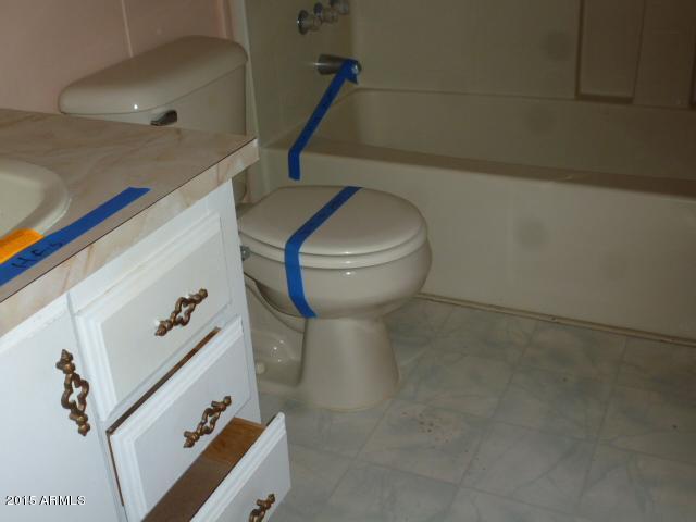 1395 South Yellow Brick Road Chino Valley, AZ 86323 - Photo 7 of 13 a bathroom with a toilet and a sink