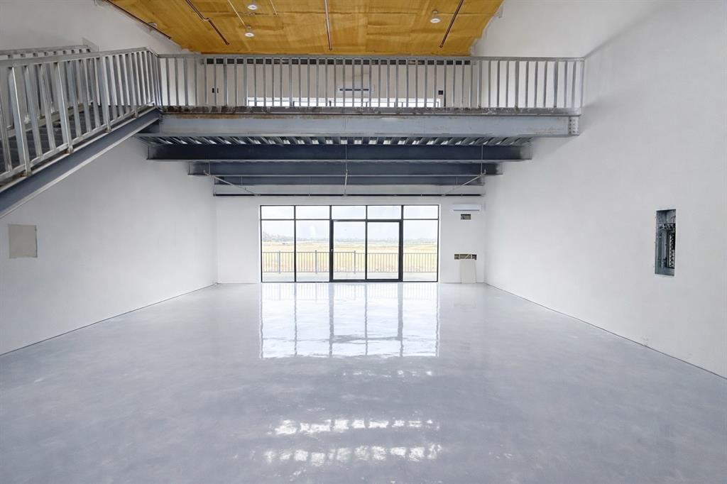 400 Fast Lane, Unit 9 Anna, TX 75409 - Photo 33 of 37 Unfurnished living room featuring finished concrete flooring, a high wood ceiling, and electric panel