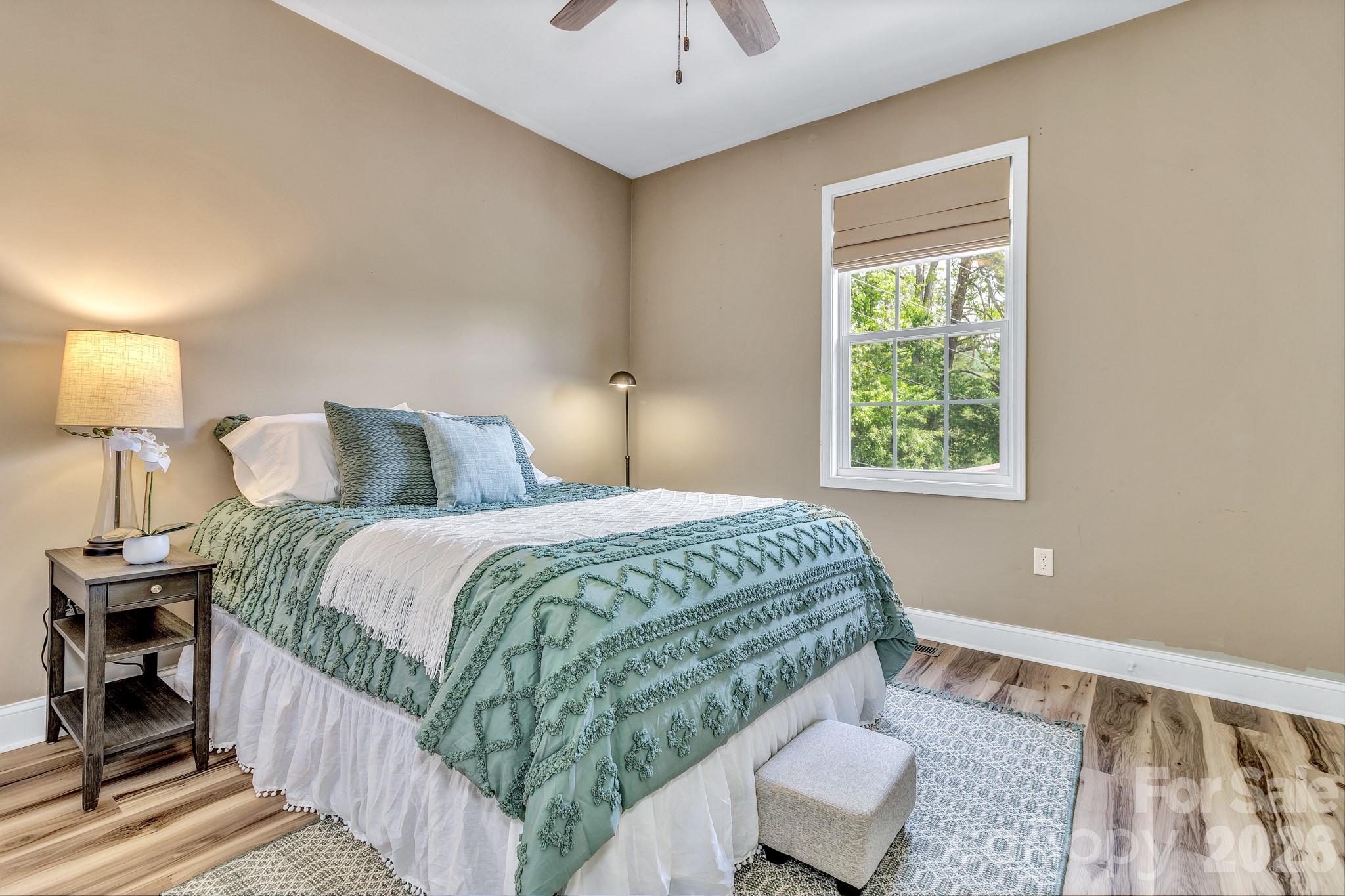 25 Union Chapel Road Weaverville, NC 28787 - Photo 19 of 47 a bedroom with a bed and a window