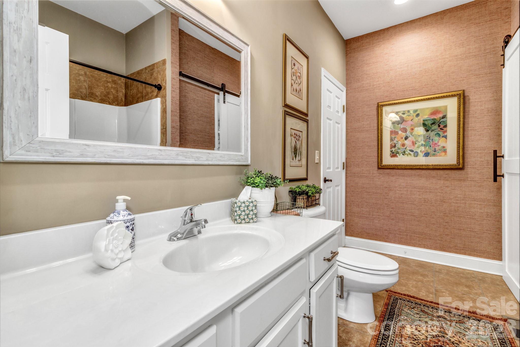 25 Union Chapel Road Weaverville, NC 28787 - Photo 22 of 47 a bathroom with a sink and a mirror