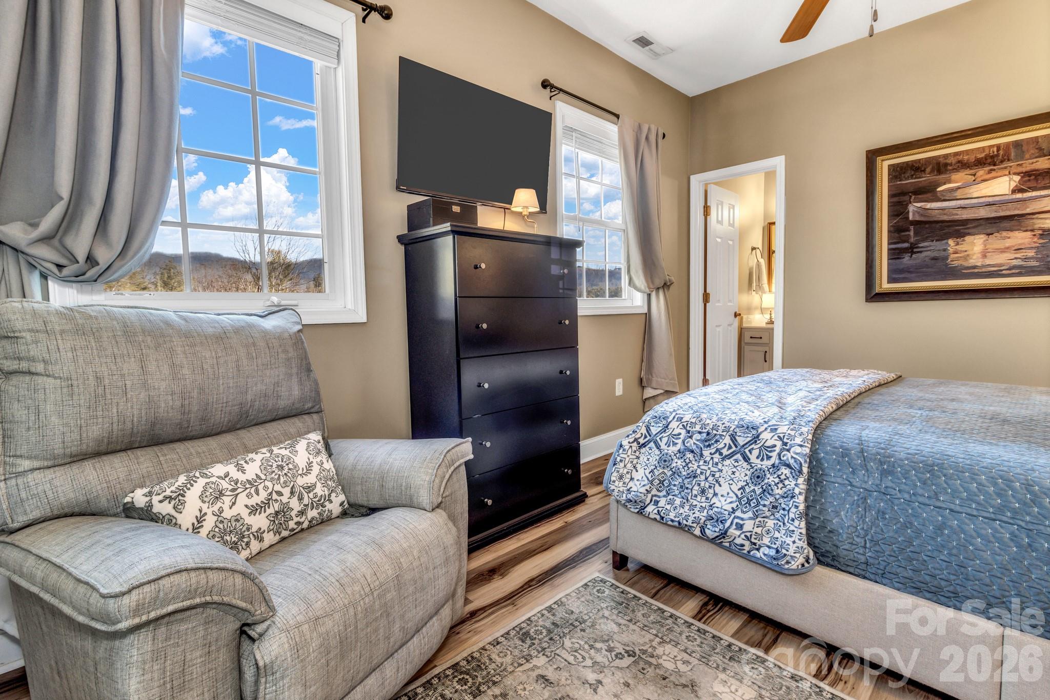 25 Union Chapel Road Weaverville, NC 28787 - Photo 28 of 43 a living room with a couch and a window