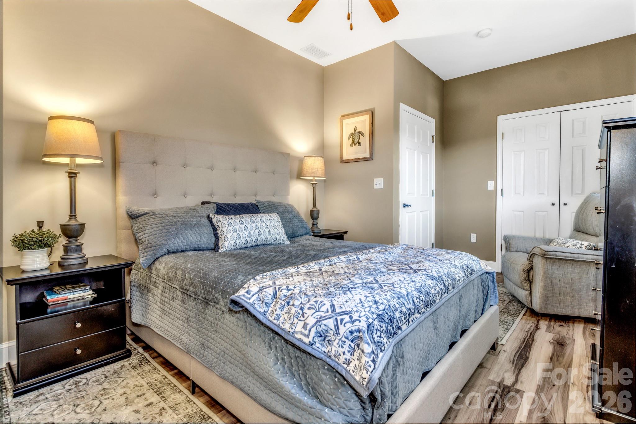 25 Union Chapel Road Weaverville, NC 28787 - Photo 31 of 43 a bedroom with a bed and painting on the wall