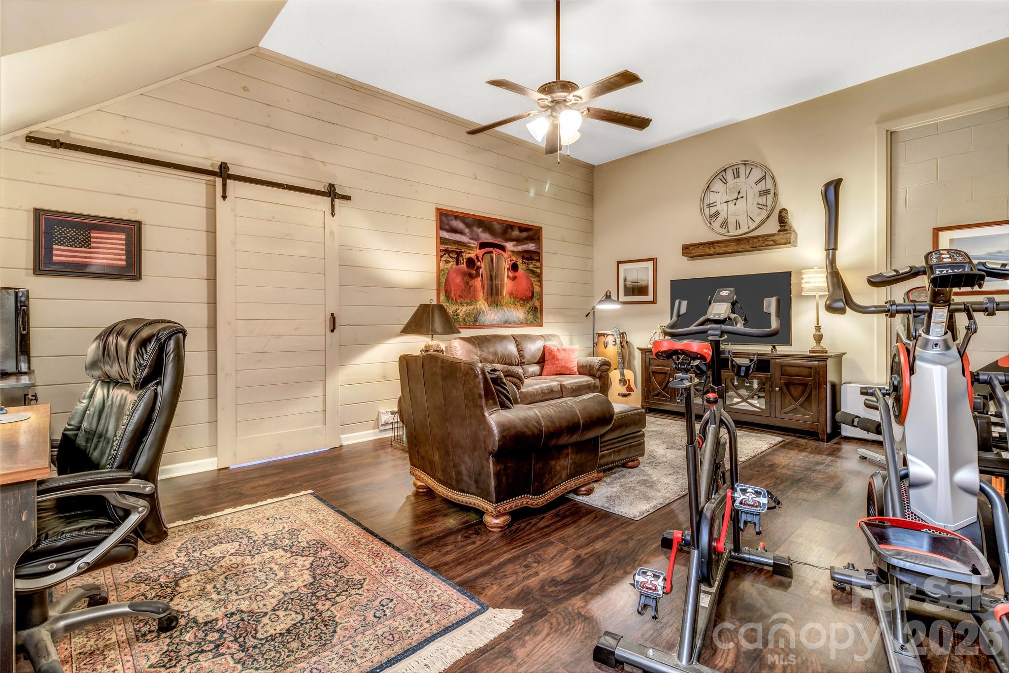 25 Union Chapel Road Weaverville, NC 28787 - Photo 33 of 43 a living room with furniture a flat screen tv and a fireplace
