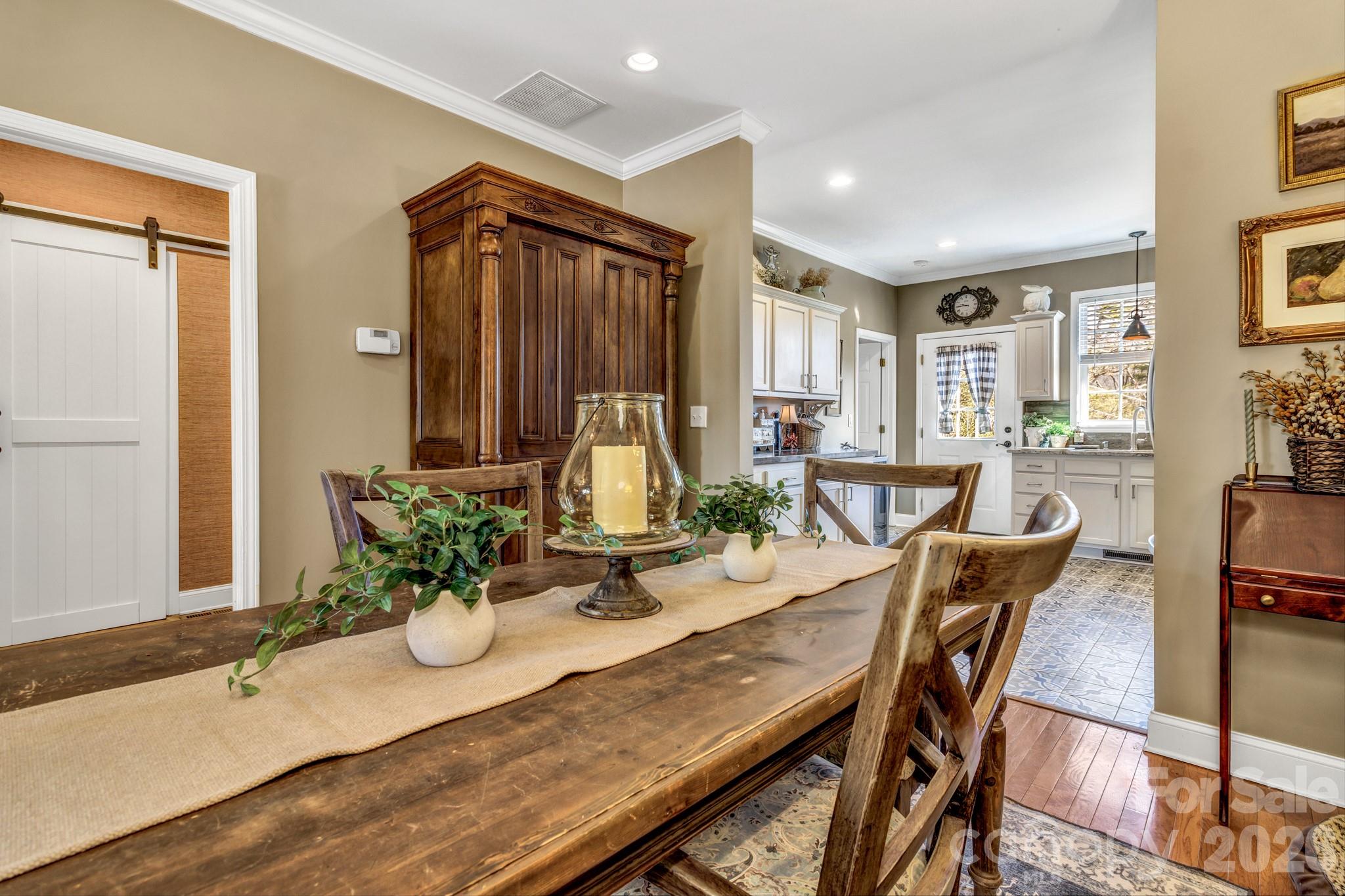 25 Union Chapel Road Weaverville, NC 28787 - Photo 10 of 43 a view of a a dining room with furniture window and wooden floor