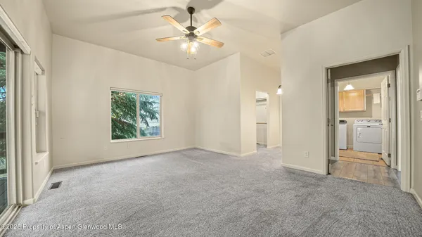 a view of an empty room with a bathroom