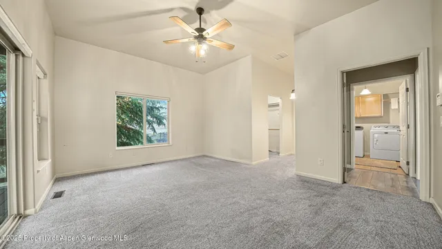 a view of an empty room with a bathroom