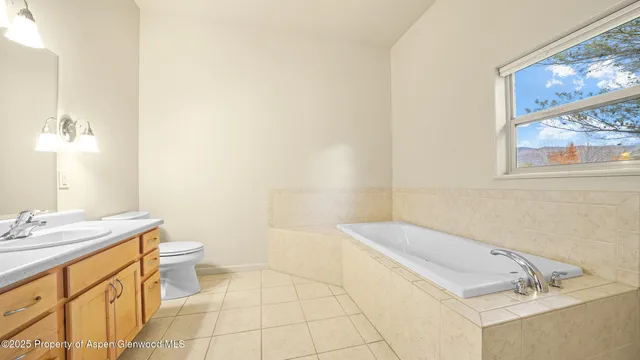 a bathroom with a sink toilet and tub