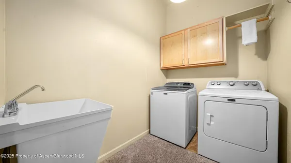 a utility room with dryer and washer