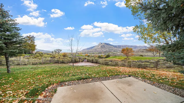 a view of a pathway with a yard