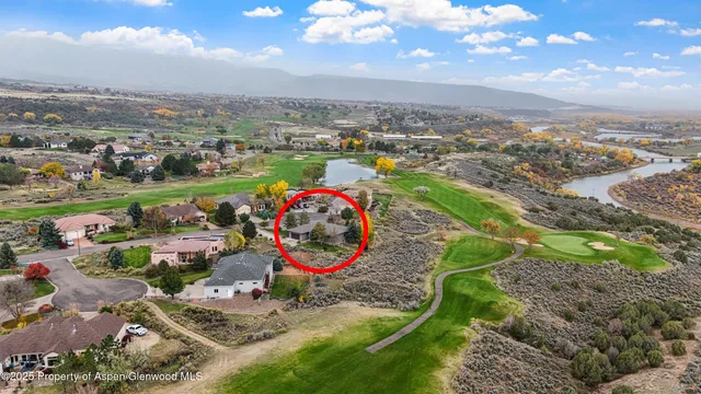 an aerial view of a houses and an outdoor space