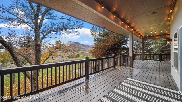 a view of balcony with wooden floor