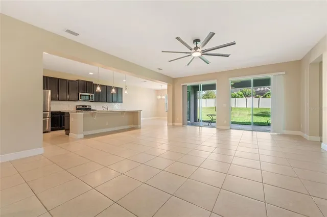 a view of a kitchen with microwave and a stove top oven