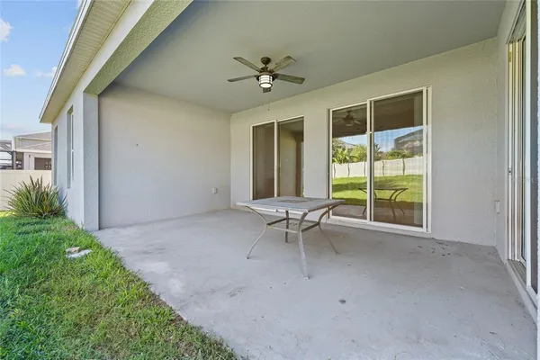 an aerial view of a house with outdoor space
