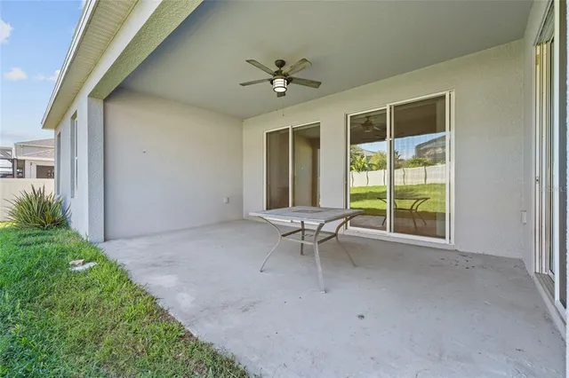 an aerial view of a house with outdoor space