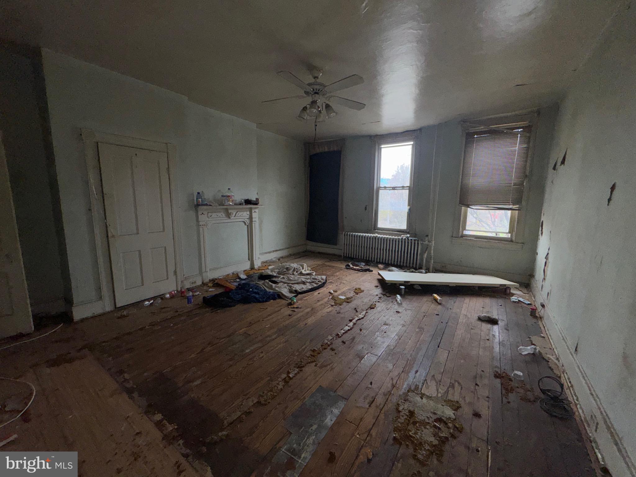 105 North Fulton Avenue Baltimore, MD 21223 - Photo 19 of 38 an empty room with a empty space and windows