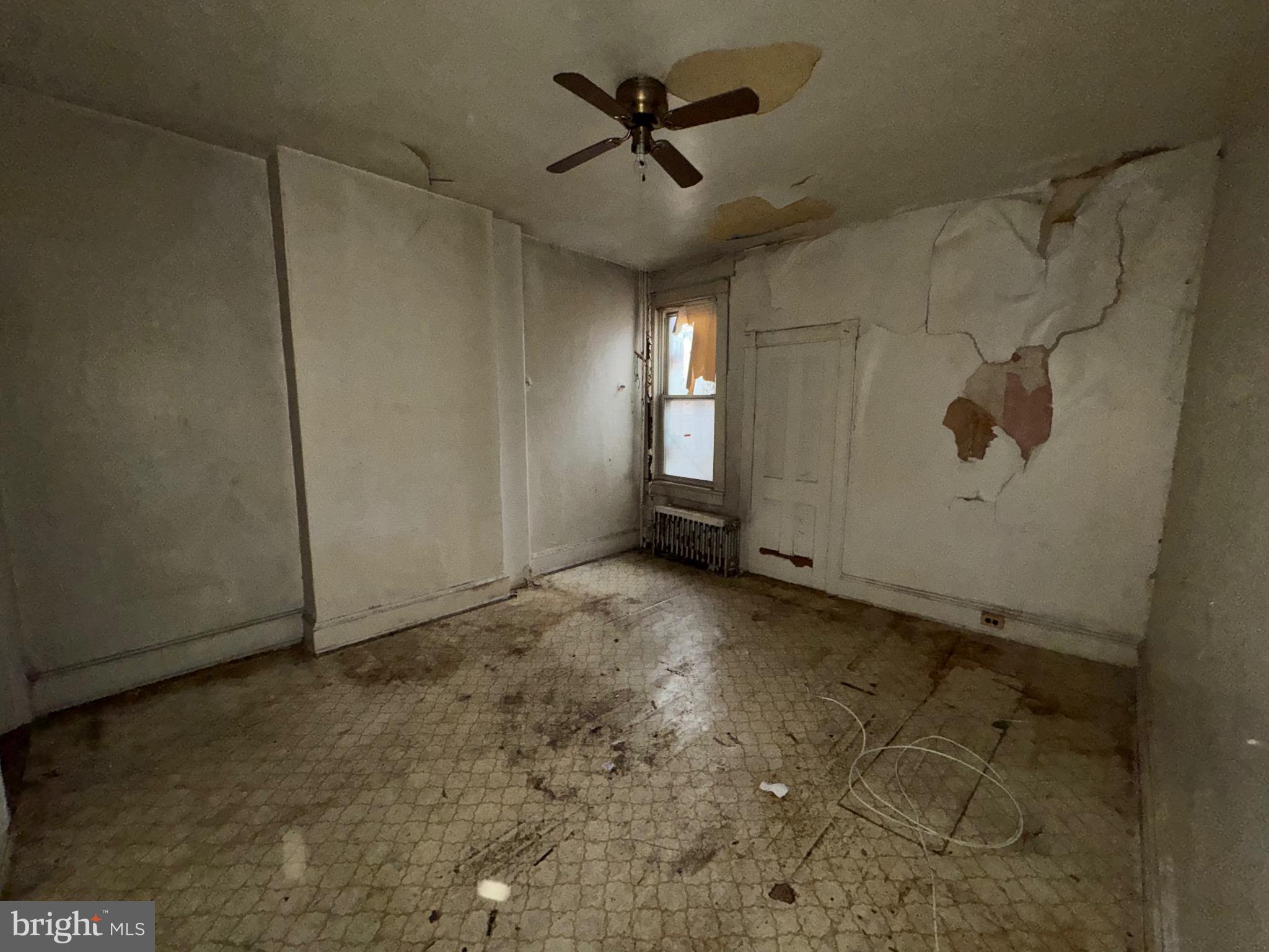 105 North Fulton Avenue Baltimore, MD 21223 - Photo 20 of 38 a view of a livingroom with a ceiling fan and window