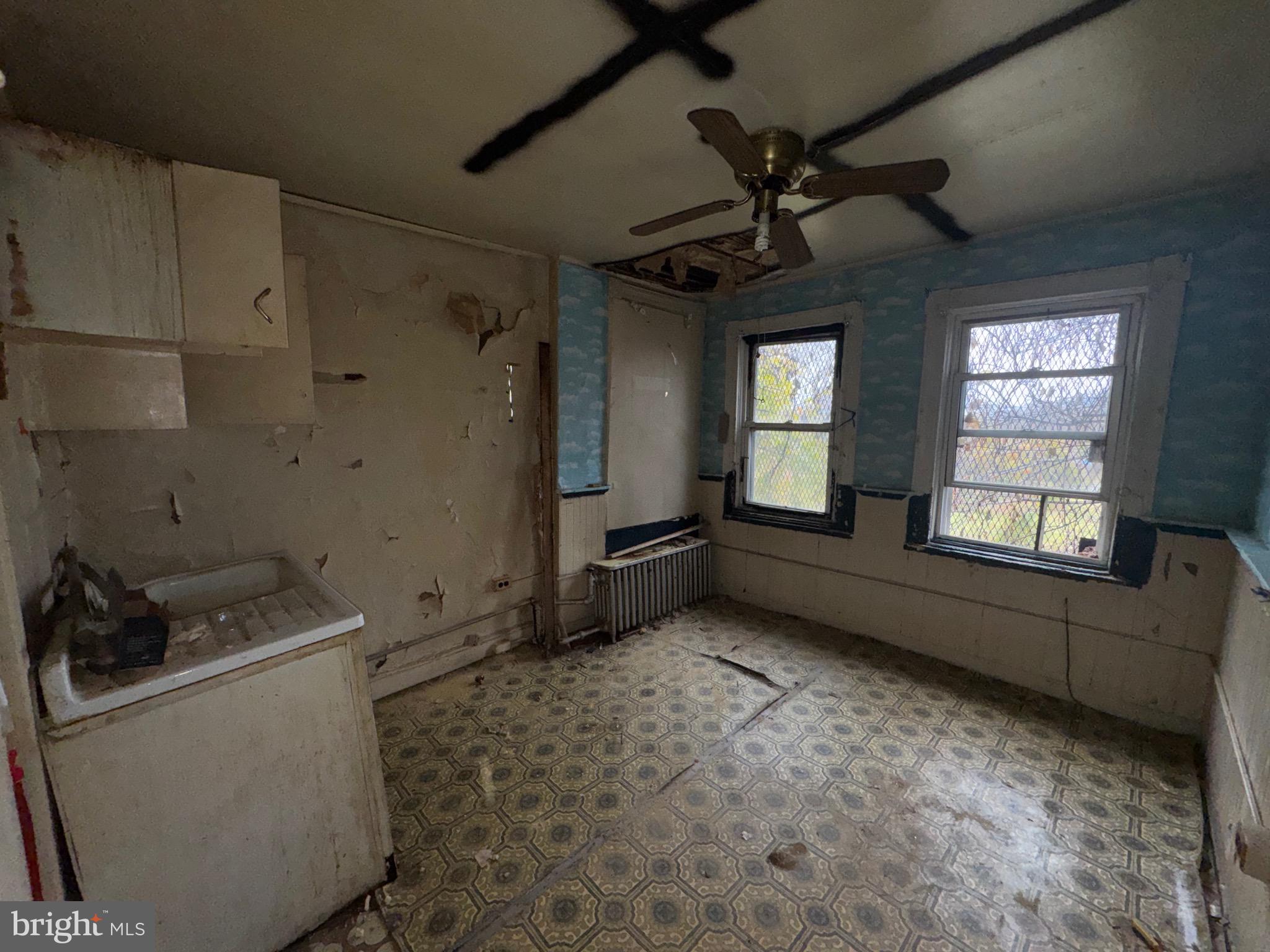 105 North Fulton Avenue Baltimore, MD 21223 - Photo 22 of 38 a room with window and furniture