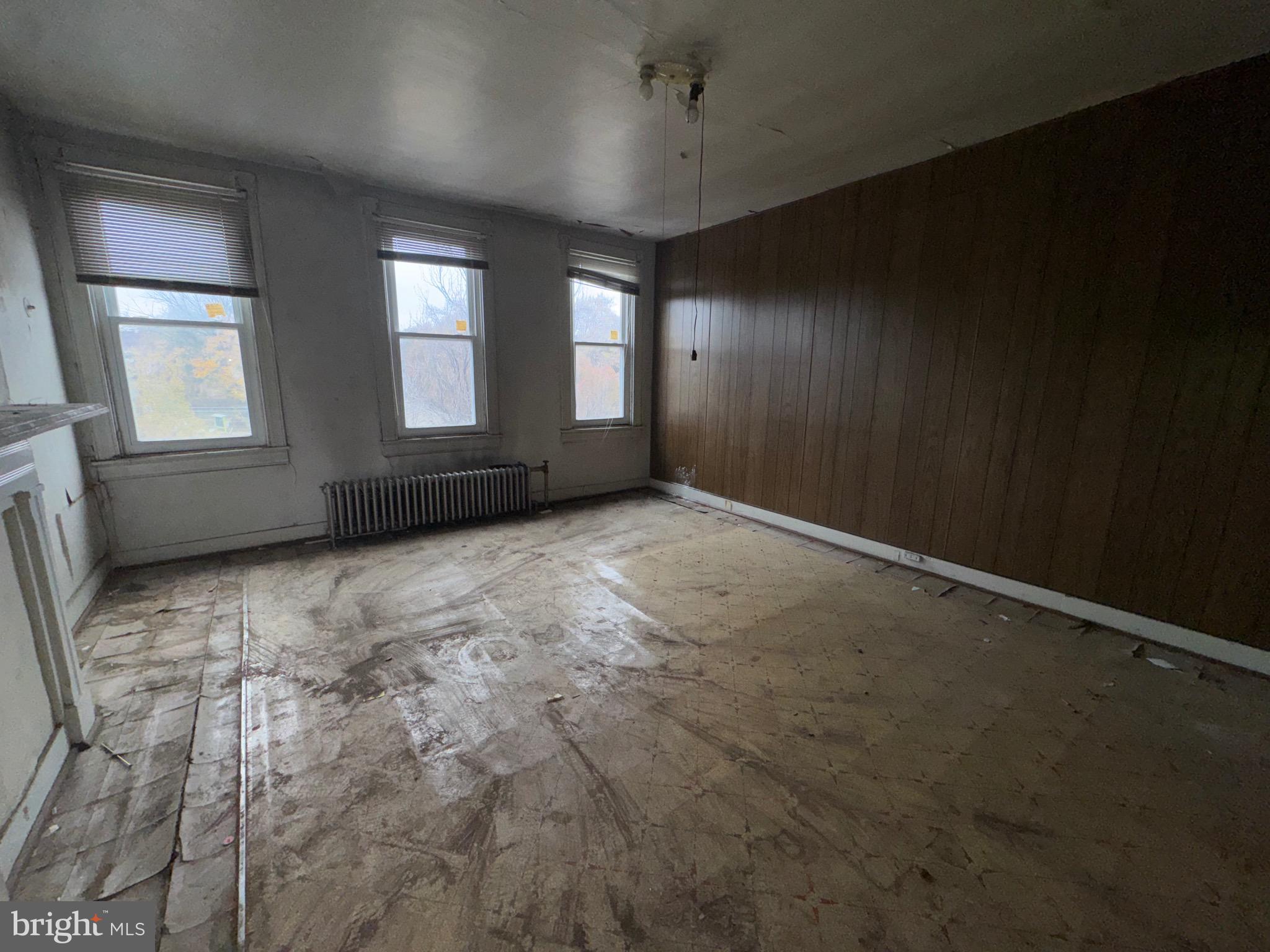 105 North Fulton Avenue Baltimore, MD 21223 - Photo 27 of 38 an empty room with windows