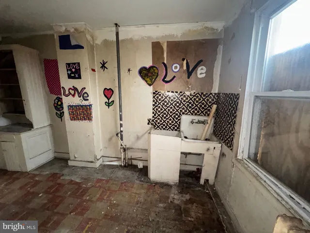 a bathroom with a shower and a sink