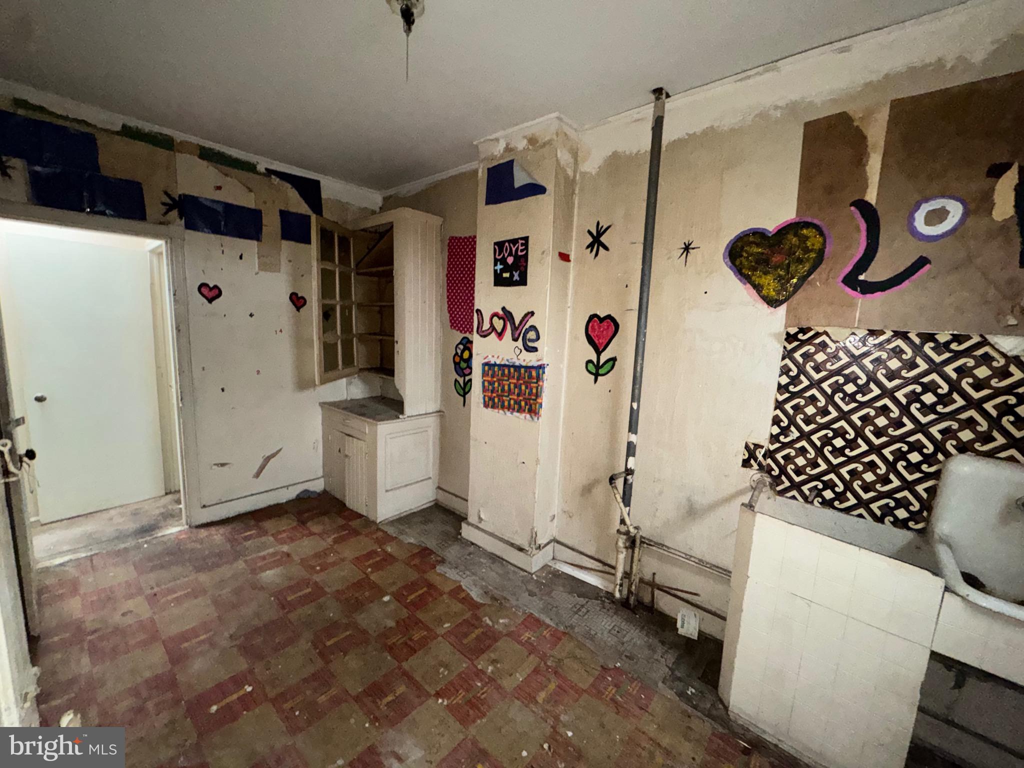 105 North Fulton Avenue Baltimore, MD 21223 - Photo 31 of 38 a bathroom with a shower and a sink