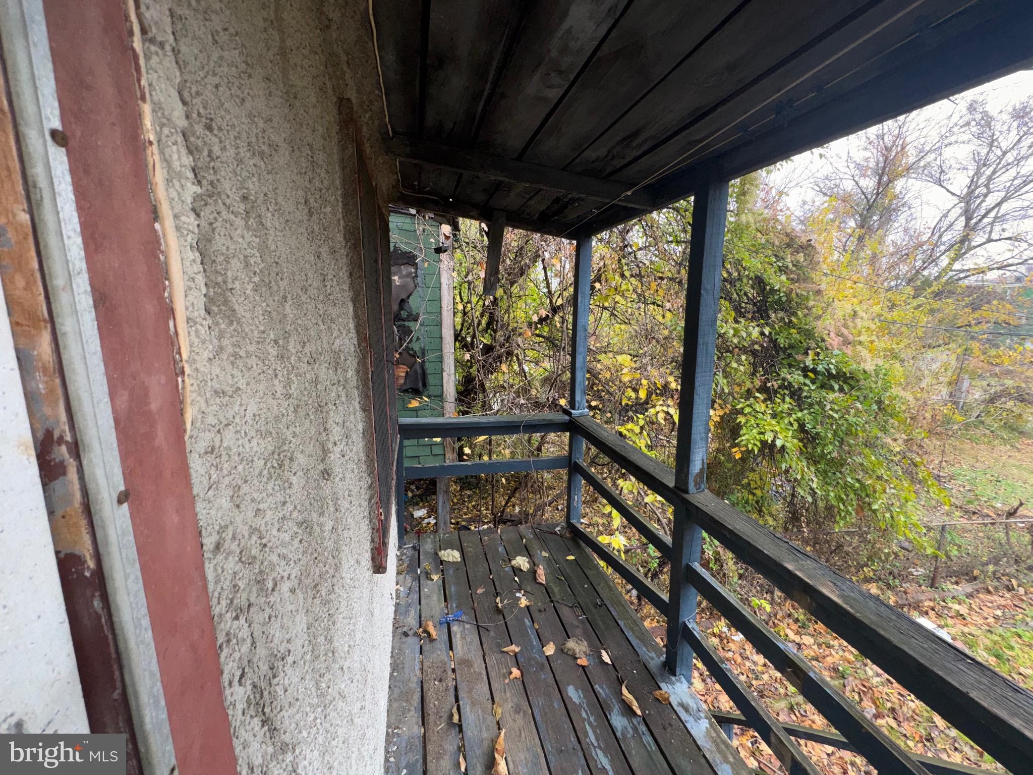 105 North Fulton Avenue Baltimore, MD 21223 - Photo 35 of 38 a view of balcony with wooden floor