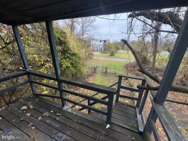 a view of balcony with wooden floor