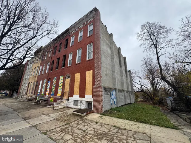 a view of a building with a yard