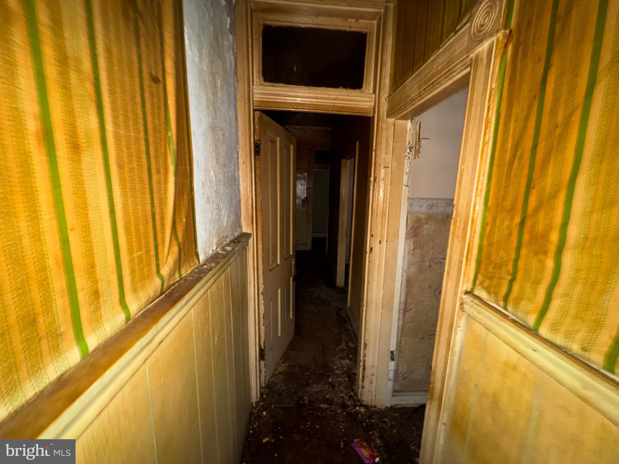 105 North Fulton Avenue Baltimore, MD 21223 - Photo 10 of 38 a view of a door and wooden floor