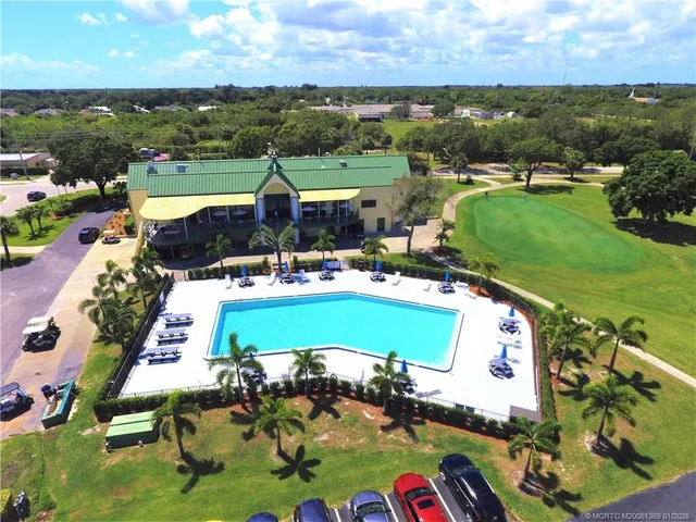 an aerial view of a pool patio patio swimming pool and outdoor seating