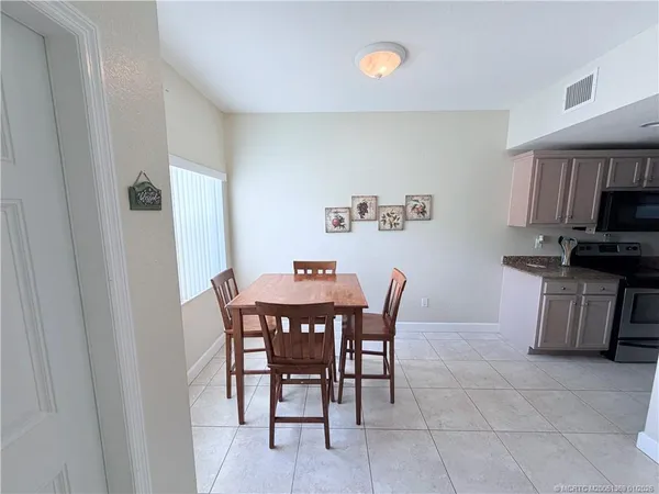 a view of a dining room with furniture