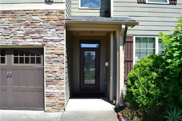 a front view of a house with a garage