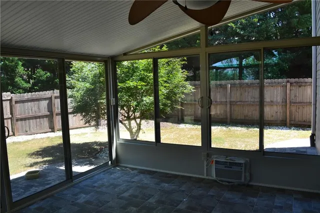 a view of an empty room with a large window