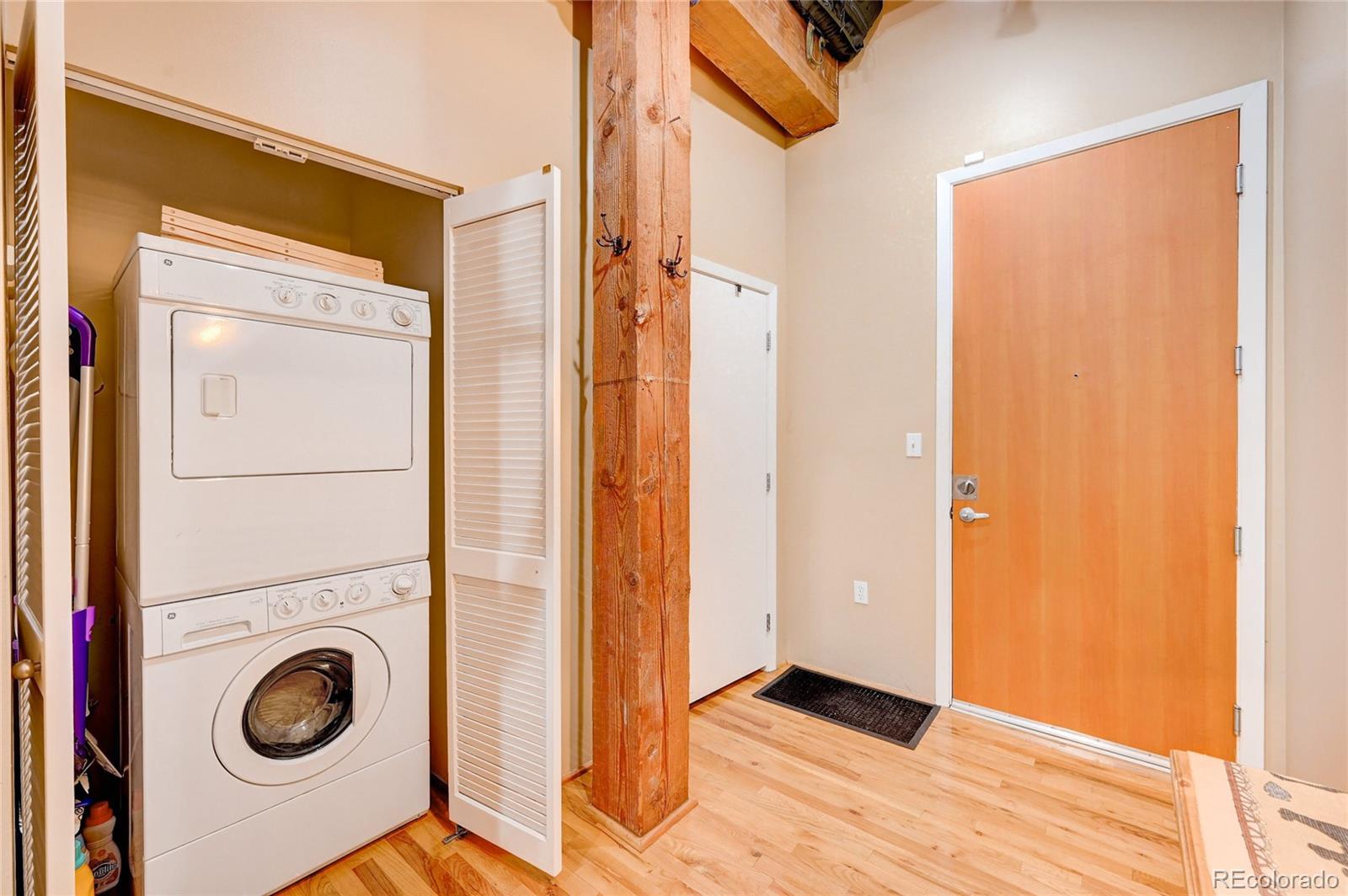 2960 Inca Street, Unit 313 Denver, CO 80202 - Photo 21 of 27 a view of a storage & utility room with washer and dryer