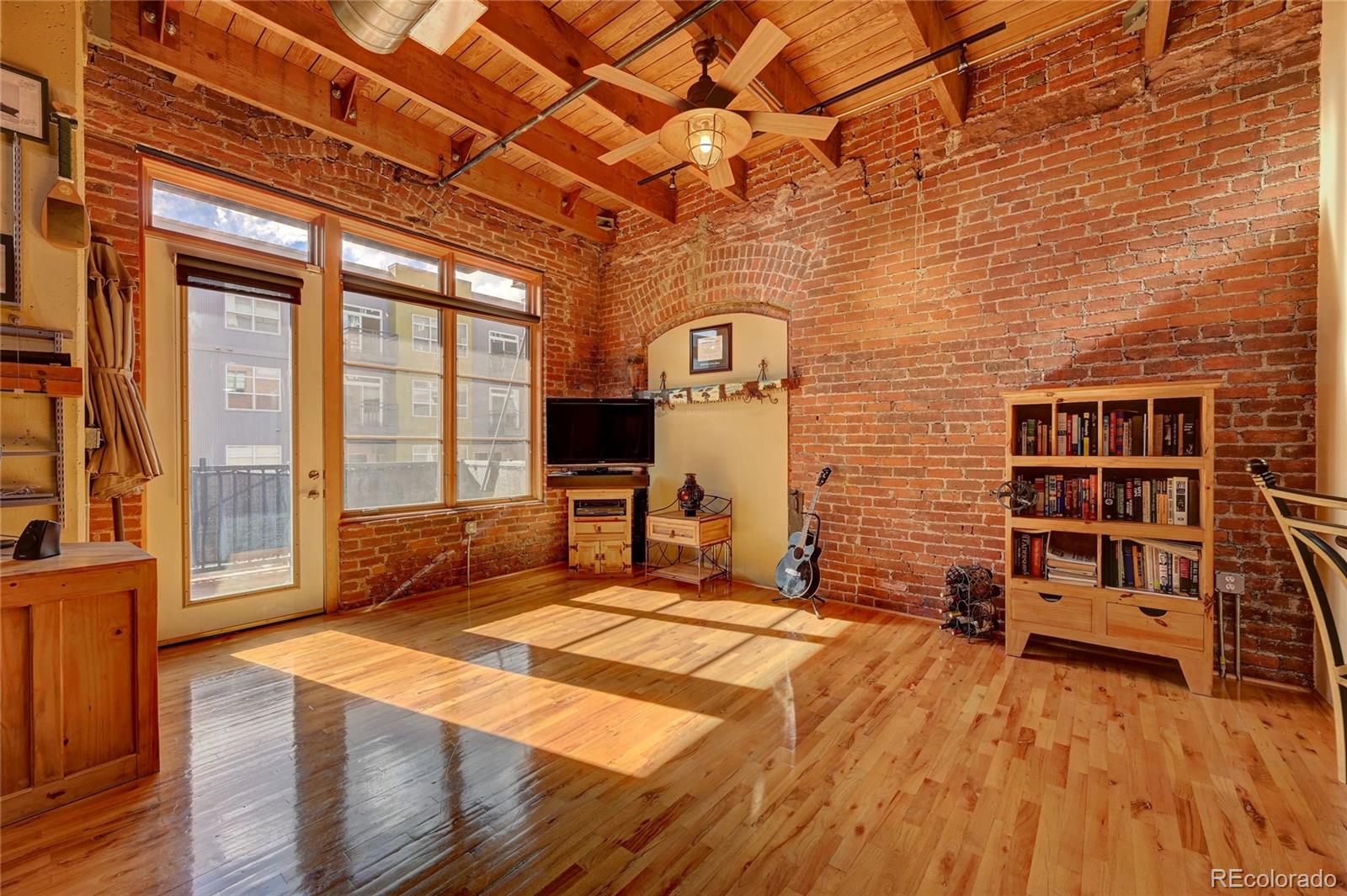 2960 Inca Street, Unit 313 Denver, CO 80202 - Photo 8 of 27 a view of a livingroom with furniture and staircase