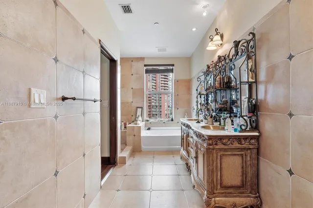 a kitchen with stainless steel appliances a refrigerator and a stove
