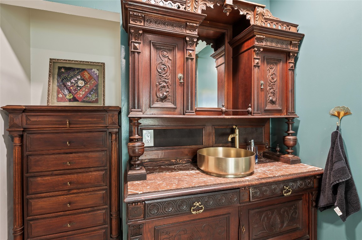 1908 Deats Road Dickinson, TX 77539 - Photo 20 of 41 Custom wood vanity with granite counter tops and brass sink.