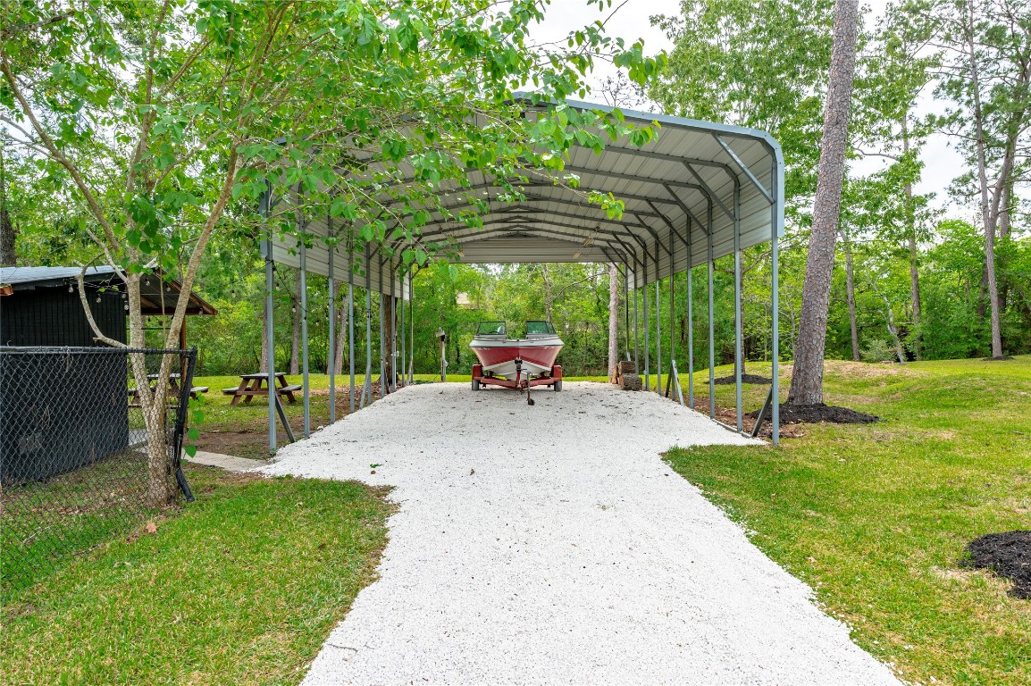 1908 Deats Road Dickinson, TX 77539 - Photo 29 of 41 Large covered boat/rv parking with rock driveway.