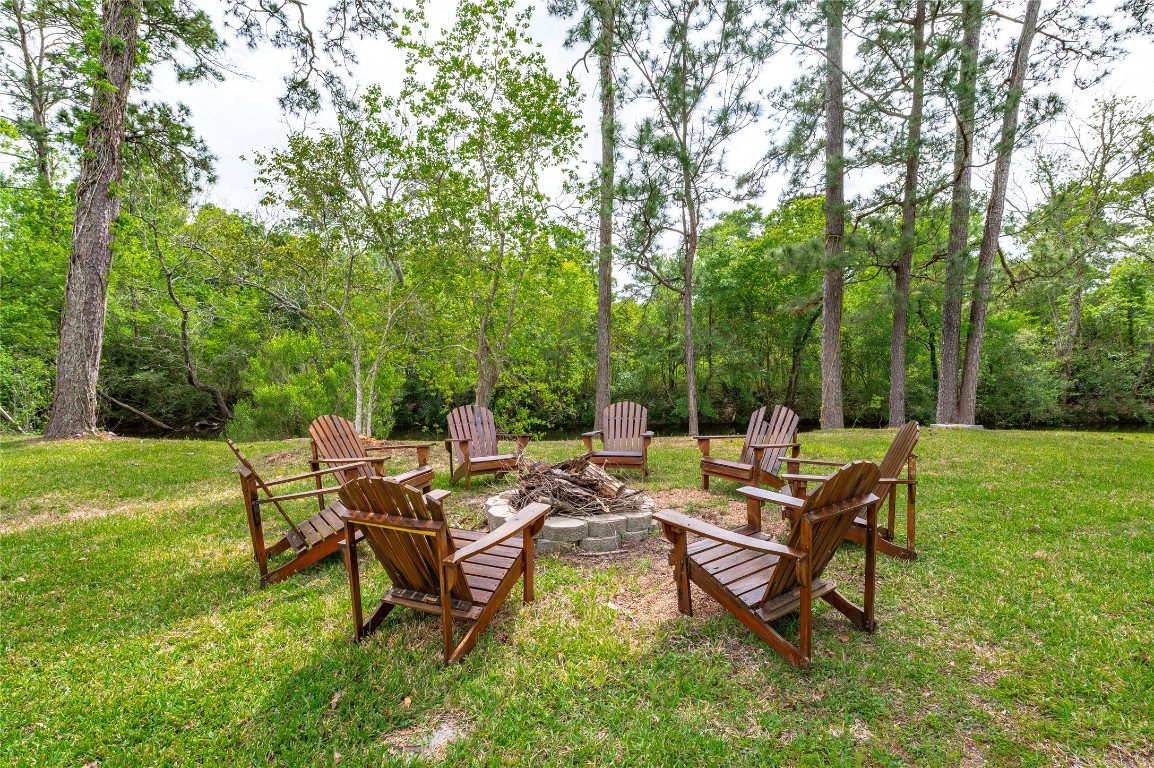 1908 Deats Road Dickinson, TX 77539 - Photo 36 of 41 Enjoy the day or evening from the firepit with creek views.