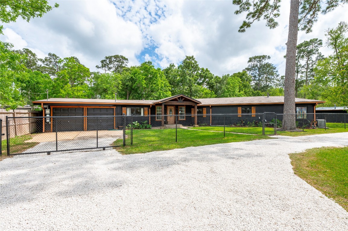 1908 Deats Road Dickinson, TX 77539 - Photo 5 of 41 Sliding gated driveway with access to the two car garage.