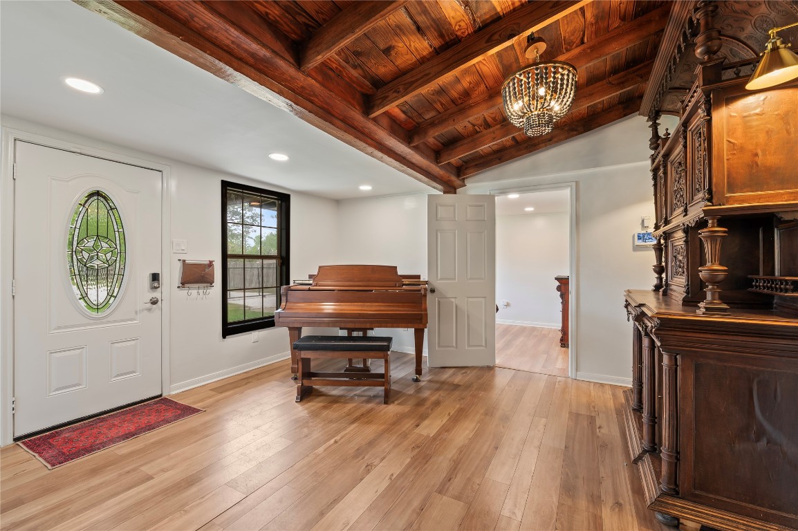 1908 Deats Road Dickinson, TX 77539 - Photo 8 of 41 Interior is beautiful and charming with wood floors, wood ceilings and stunning fixtures.