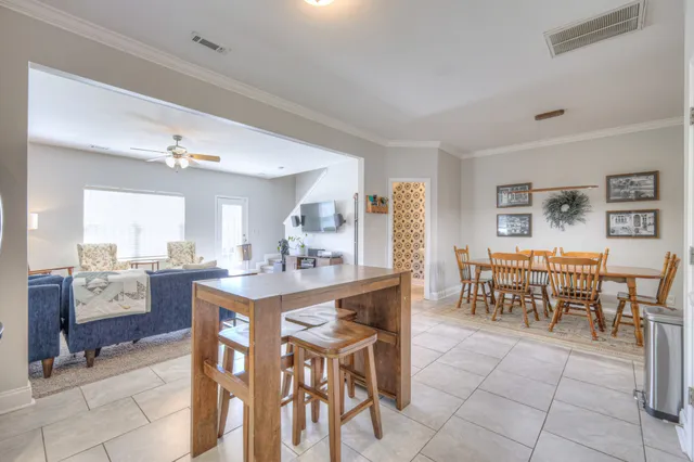 a view of a dining room with furniture and a lots of tables
