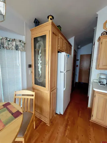 a kitchen with stainless steel appliances granite countertop a refrigerator a stove and a refrigerator