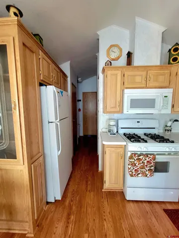 a view of a refrigerator in kitchen